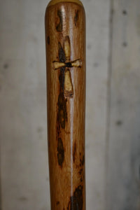 Woodcarving of cross on walking stick