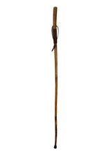 Long wooden whip with a Leather handle on a white background