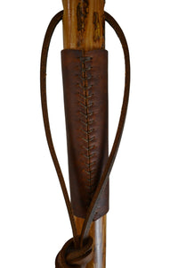 Wooden stick with a leather wrap on a white background