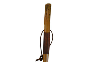 Wooden walking stick with a leather wrap on a white background