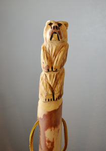 Bear Walking Stick Wood walking stick Hiking cane Walking support Balance and stability Pain relief Endurance Mobility Fashionable accessory Durable wood Customized height Trail walking Outdoor enthusiast Natural finish Handcrafted Rustic charm Sustainable wood Eco-friendly Artisan made