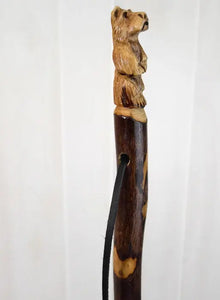 Side view of Bear carved on staff