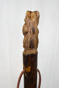 Back of bear carved on walking stick