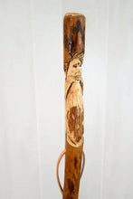 walking stick with mountain man face carved on it in elm