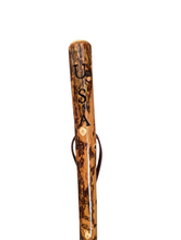 Walking stick with "USA" carved at the top of the handle with a leather strap. 