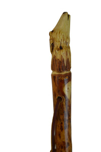 Wolf carving on walking stick 