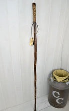 Full view of a walking stick with Wood Spirit carving