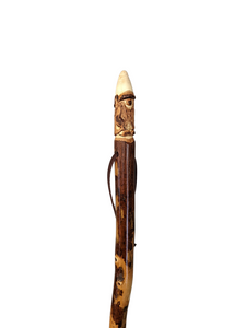 Gnome carving at the top of a walking stick.